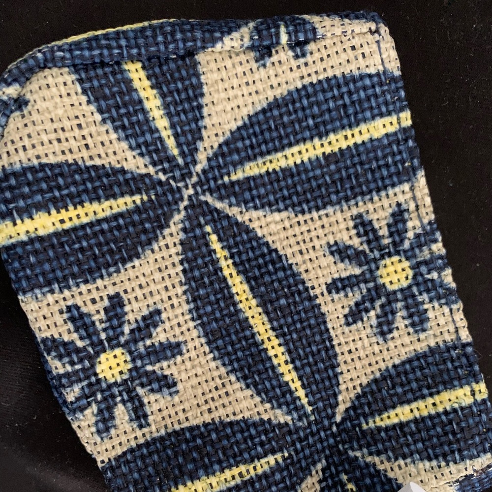 Perfect Burt’s Bees lipstick/gloss or mini-wallet or coin purse.